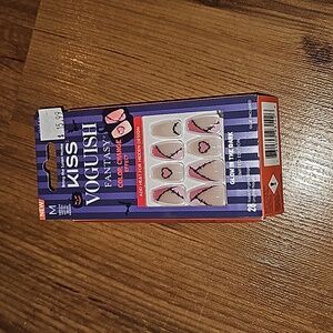 Kiss Voguish color change effects fake nails with hearts and stitches.